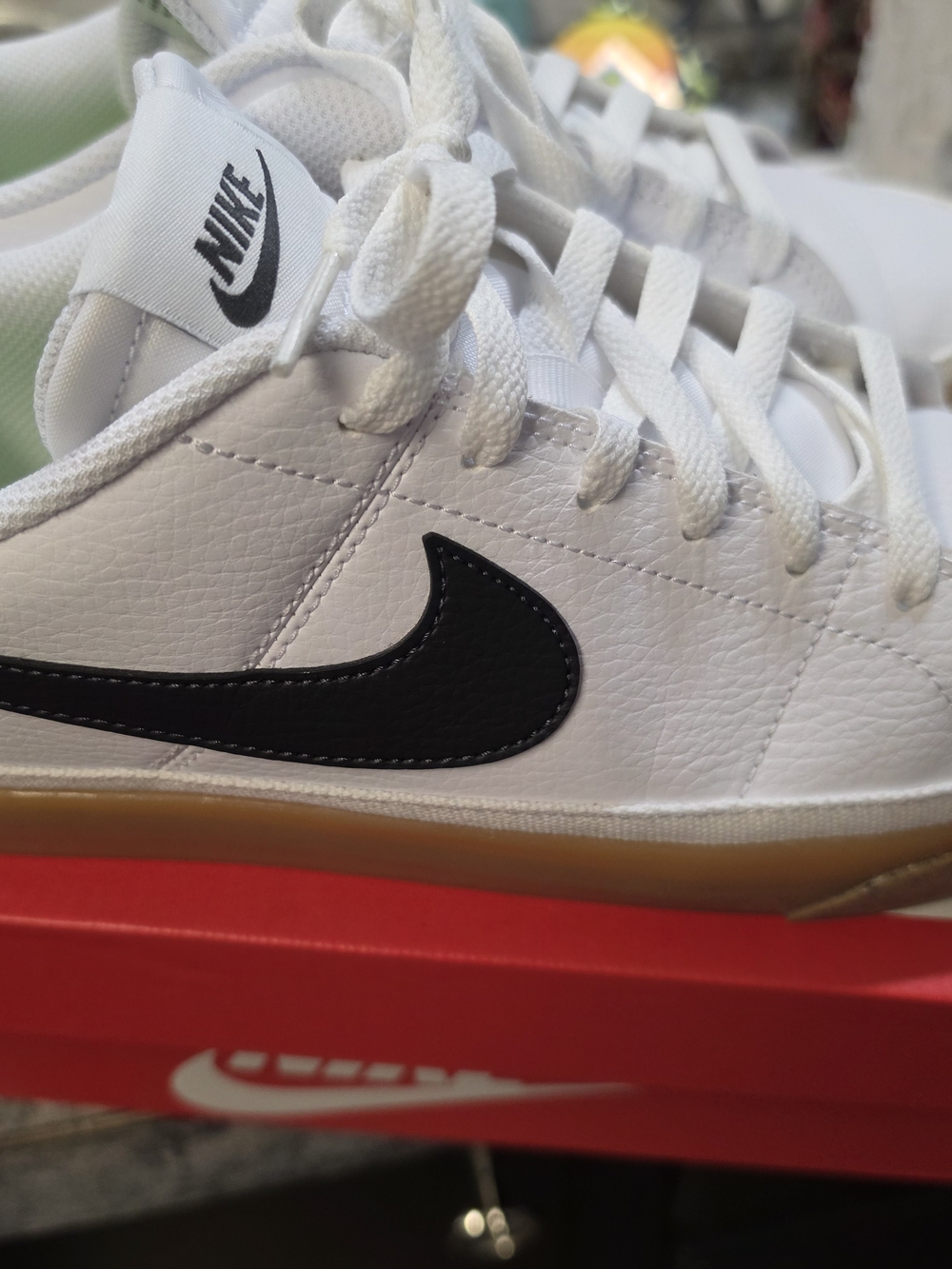 Nike Men's White Leather Sneakers with Black Swoosh